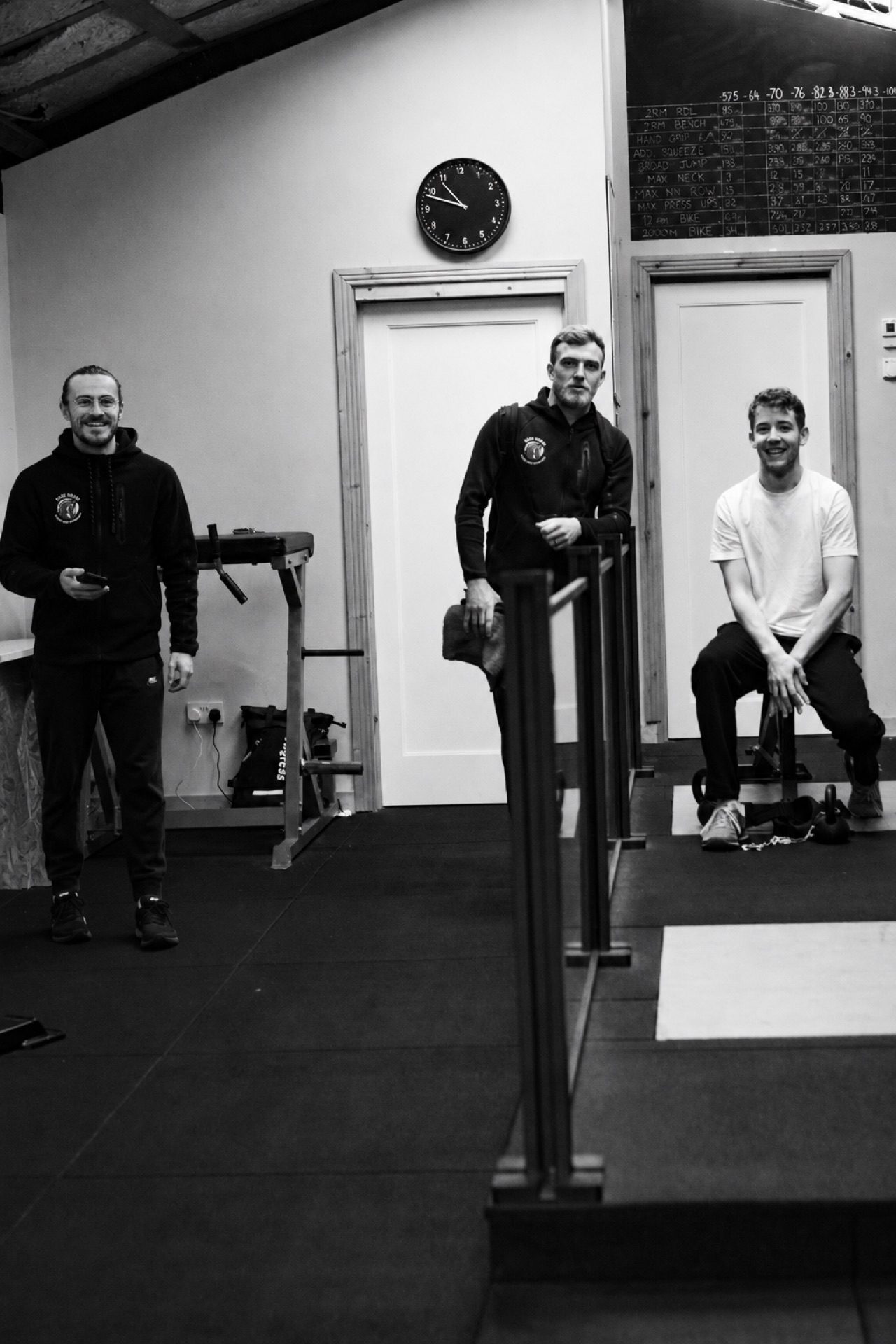 Three Dark Horse coaches in the gym.